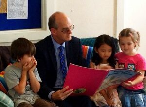 Minister Ryall reading to THH Children 300x225