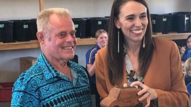 The Pirme Minister with 'Mr King' and the wooden car she made in his woodwork class.