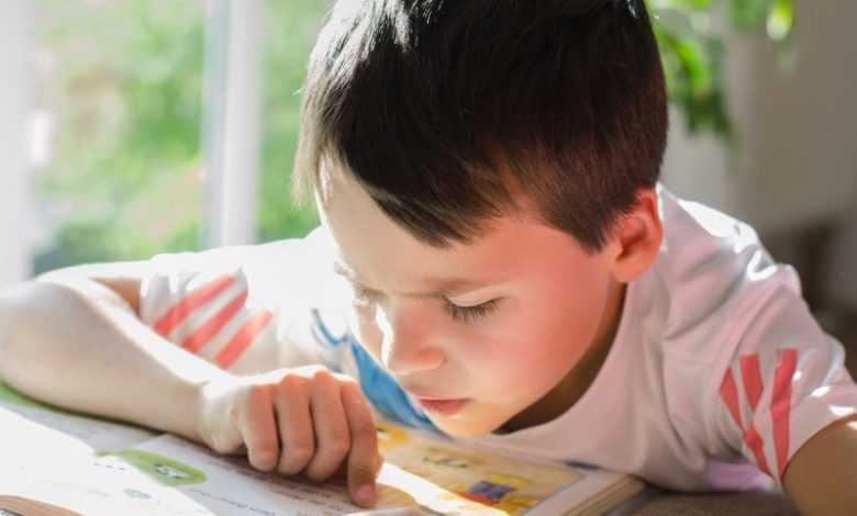 boy with dyslexia struggles to read