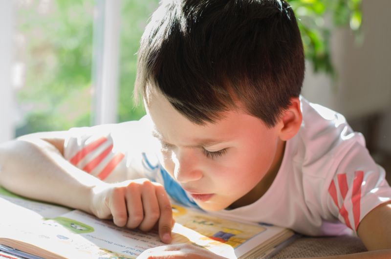 boy with dyslexia struggles to read
