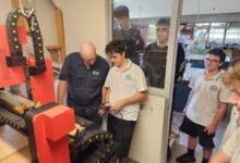 students using a cnc router