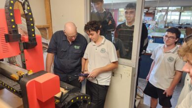 students using a cnc router